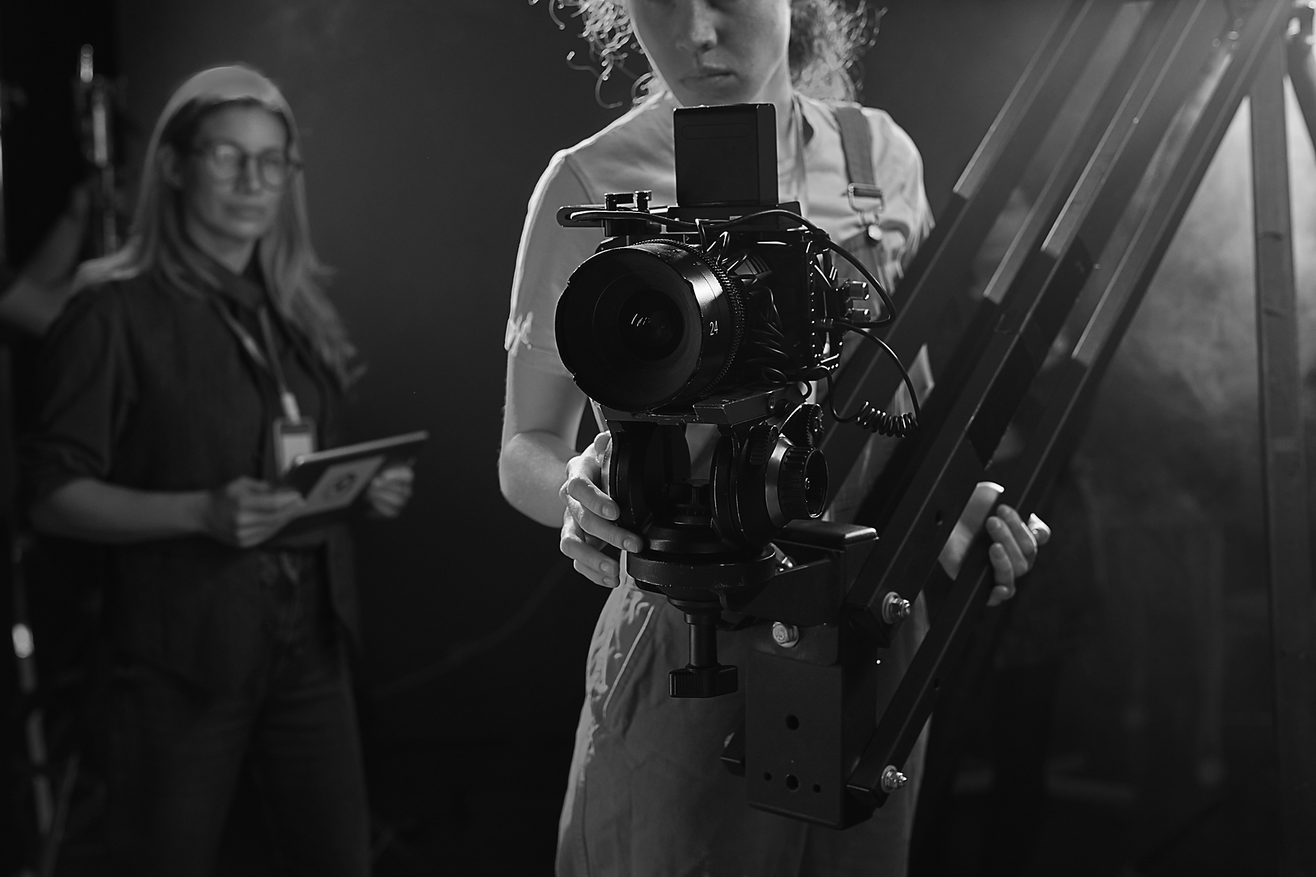Neon Hours, Video Production — Neon-lit video shoot with a subject framed against coloured practicals